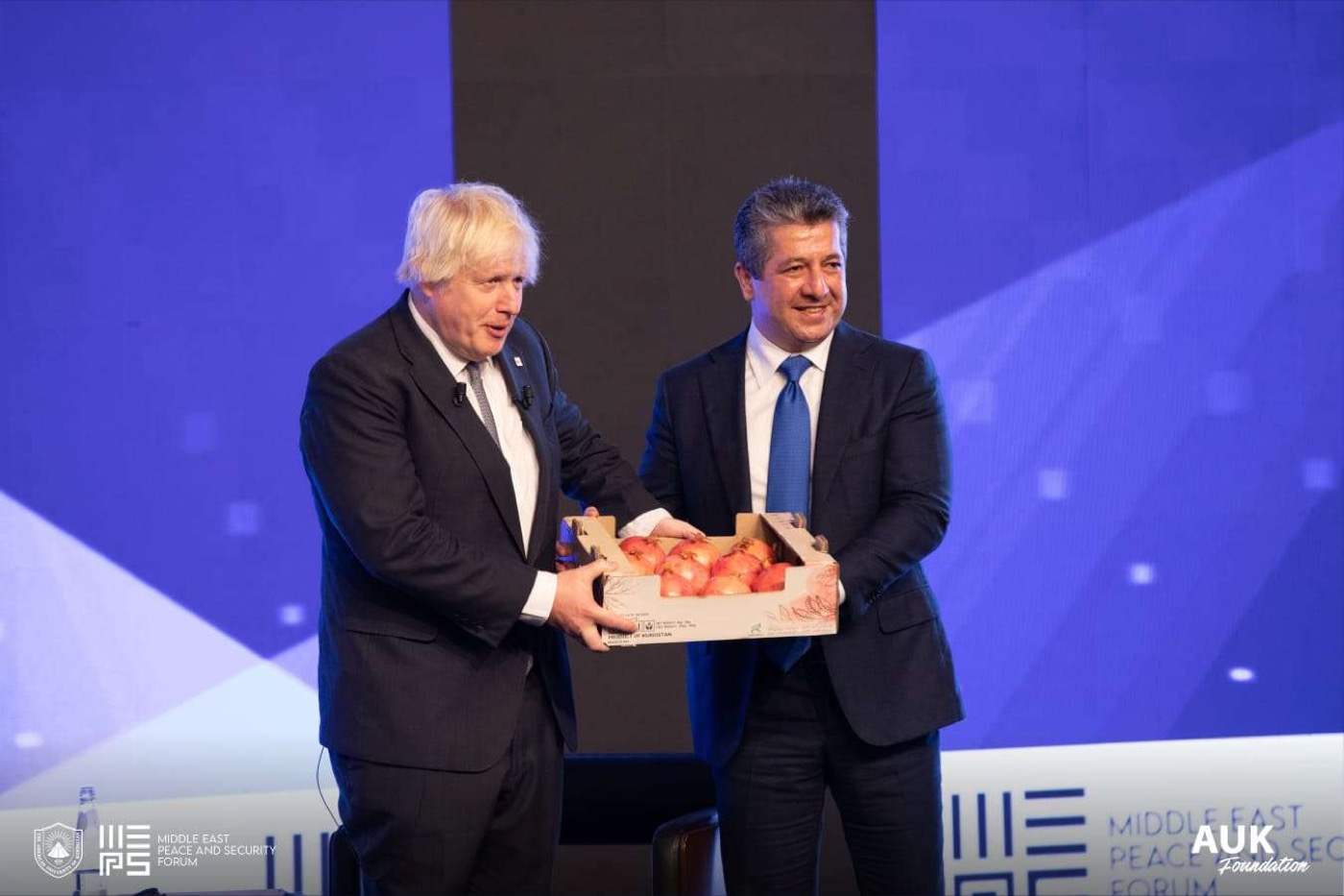 Image of Boris Johnson gives praise and gets pomegranates at MEPS Forum 