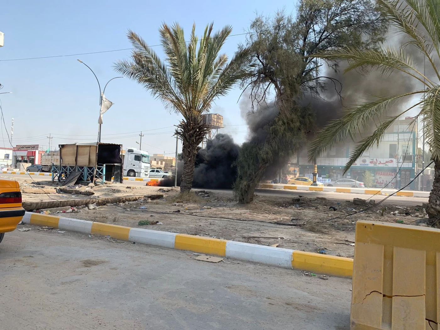 Image of Iraqis protest electricity shortage as summer starts